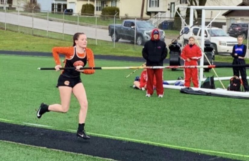 girl running with javelin