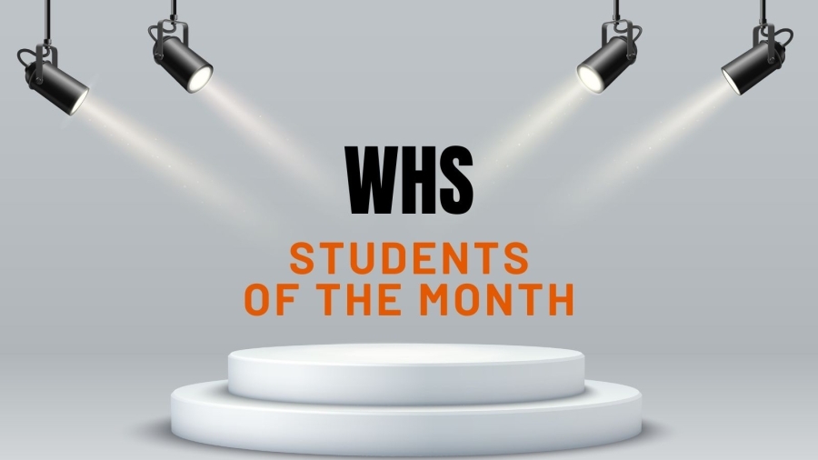"WHS Students of the Month" with spotlights on stage