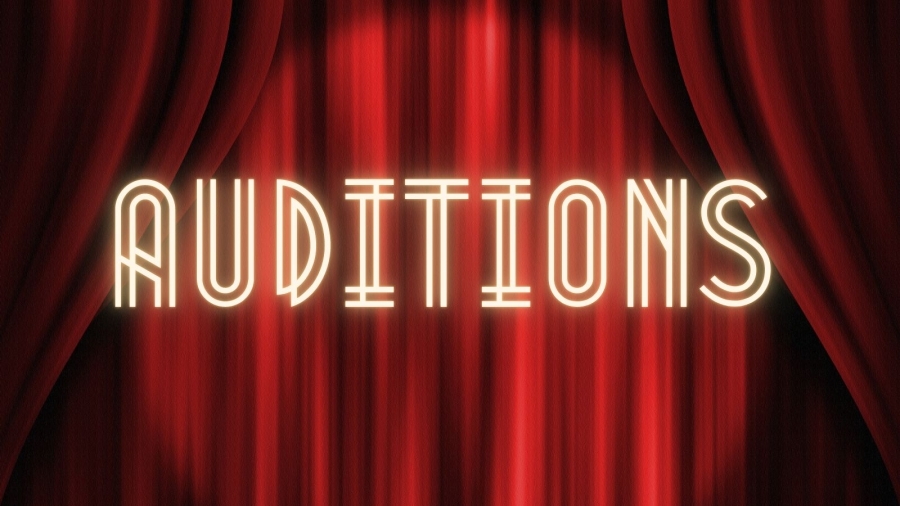 "Auditions" text on red curtain backdrop