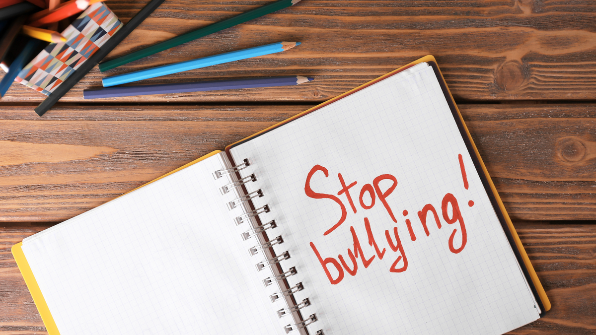 stop bullying written in notebook